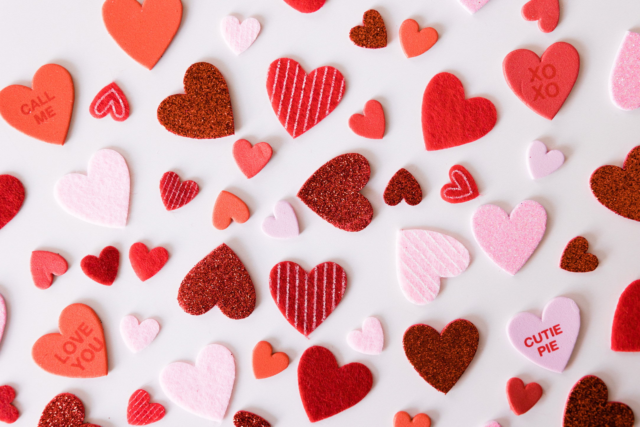 Pink and Red Hearts on Light Background